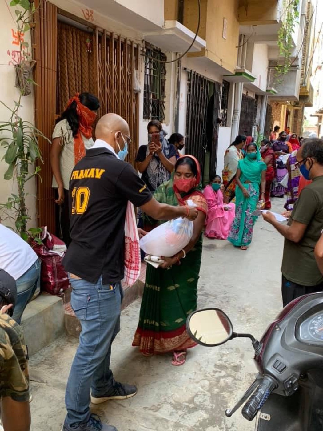 Doorstep ration support during Prattyancha's COVID-19 relief work