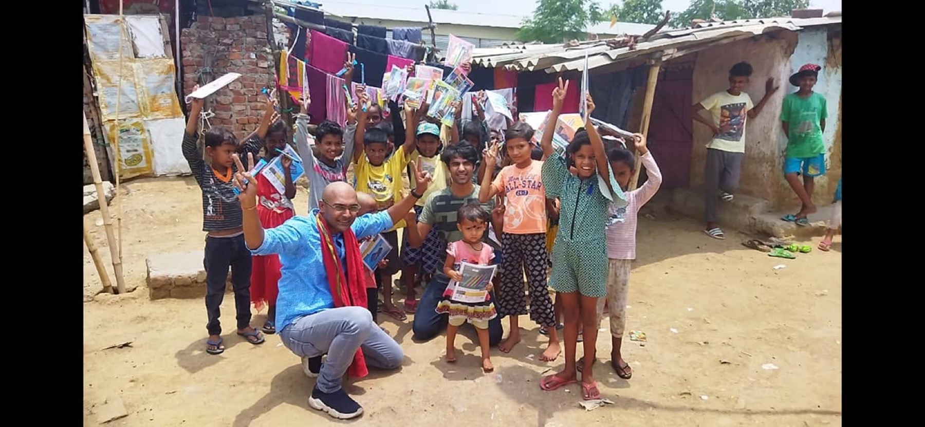 Children holding study material during a Prattyancha education support activity